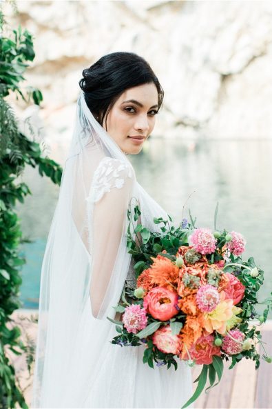 Bride with veil at Lake Vouliagment for her elopement in Greece