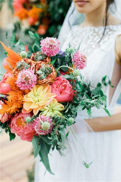 Colorful wedding bouquet held by bride