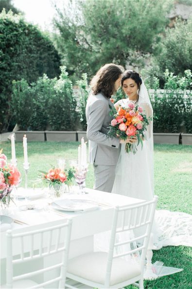Bride and Groom in front of their wedding table for their elopement in Greece