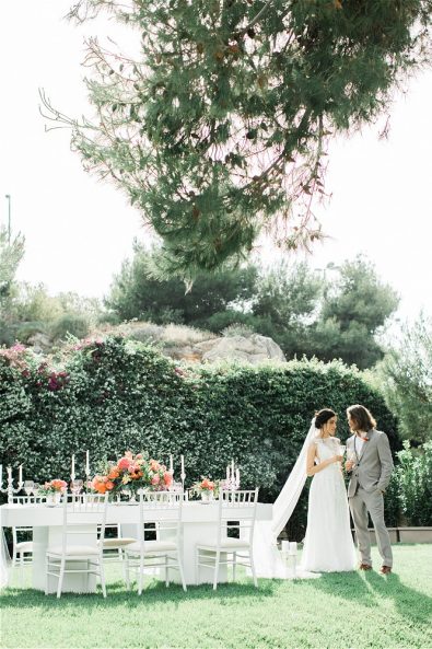 Bride and Groom in front of their wedding table