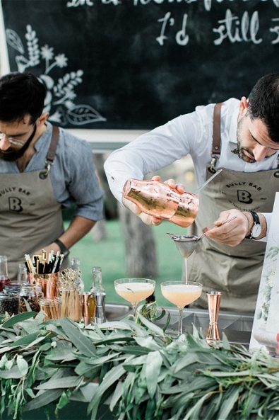 Barmen serving cocktails from van for an elopement in Greece