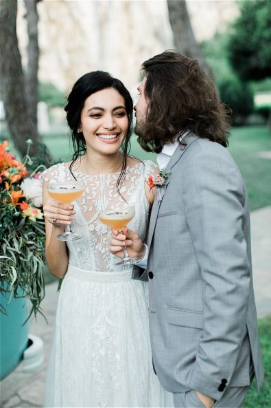 Groom and Bride enjoying cocktails at their elopement in Greece