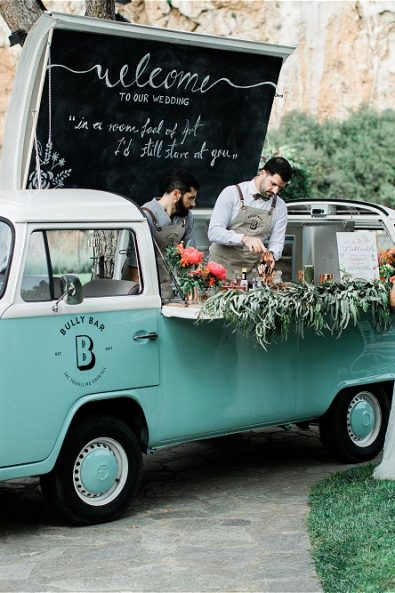 Bar and Groom in front of Van serving drinks