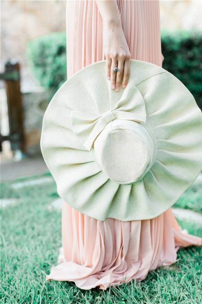 Wedding ring hand of bride holding hat