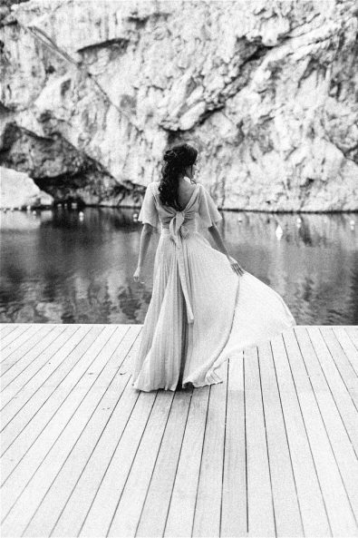 Black and white photo of Bride in dress at her elopement in Greece