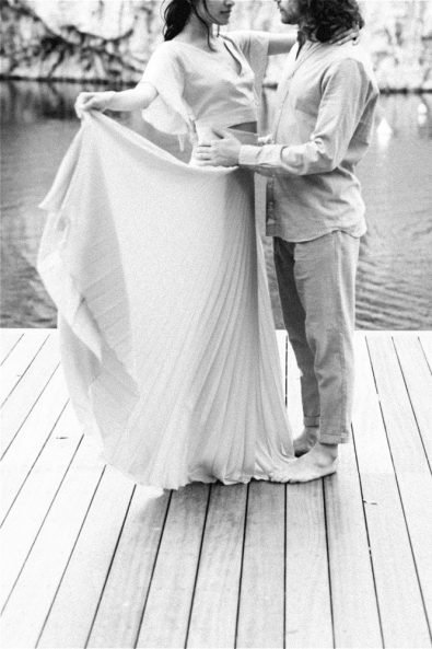 Black and White photo of Groom holding Bride