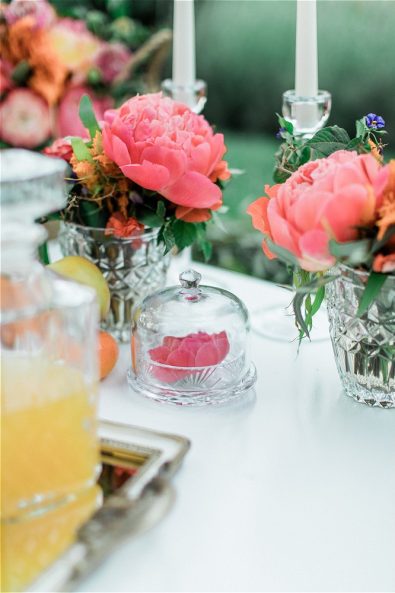 Flower decorated glassware on wedding table