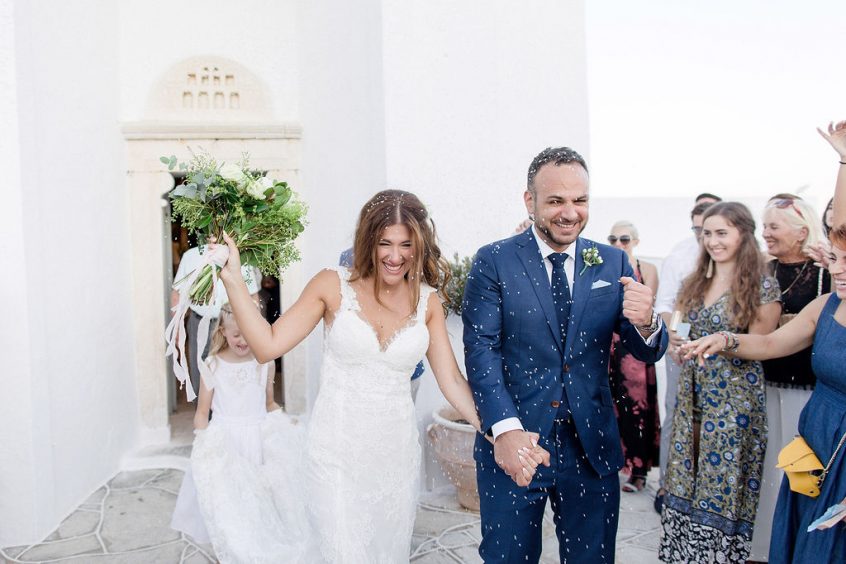 Couple after getting married in Greece at a church