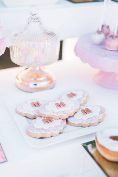 Custom made personalized sugar paste covered butter cookies with rose gold details.