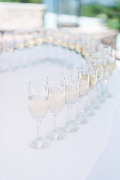 Champagne glasses filled with champagne for guests to enjoy.