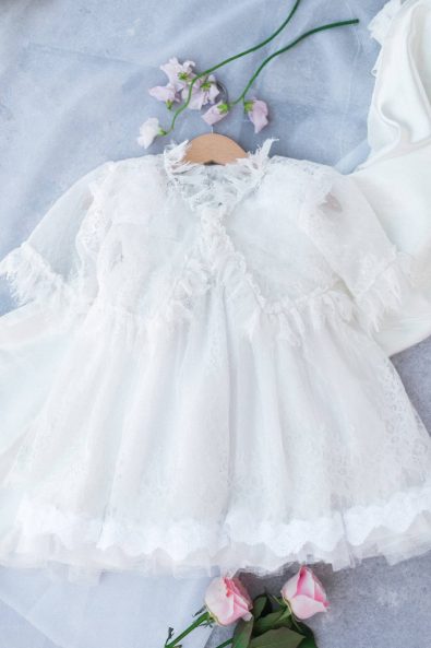 Baby girl's romantic white lace and tulle christening dress for a baby christening in Greece.