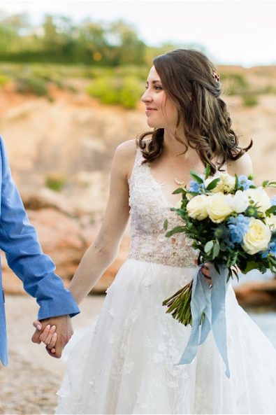 Bride and groom holding hands