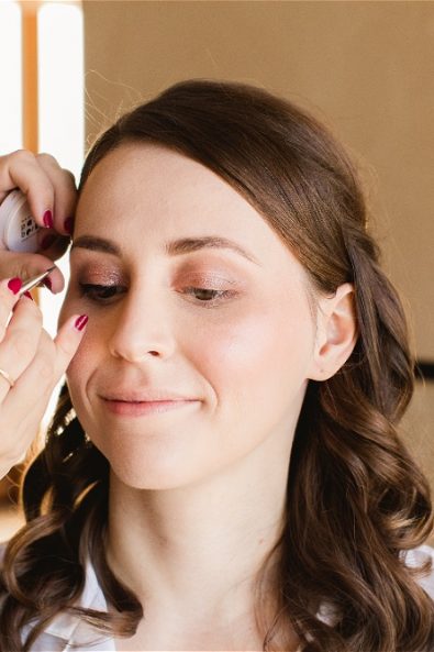 Bride getting her makeup done