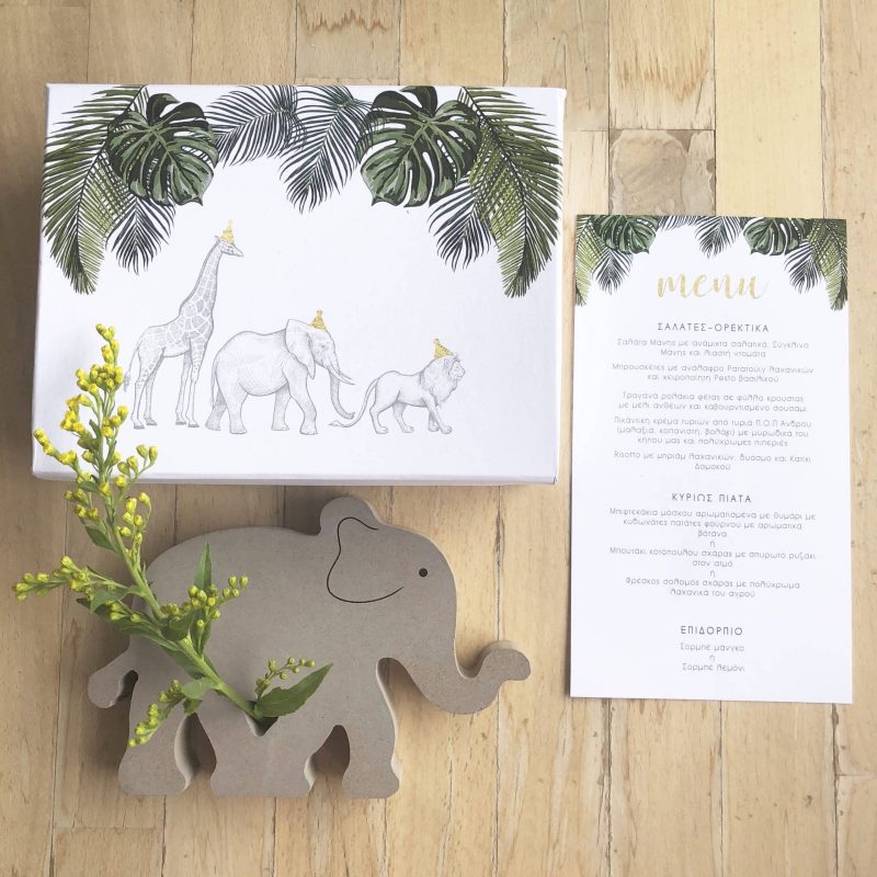 White Stories events: Jungle animals inspired menu and gift box and wooden elephant with flower.