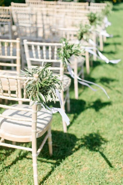 Wedding chairs with flowers on garden
