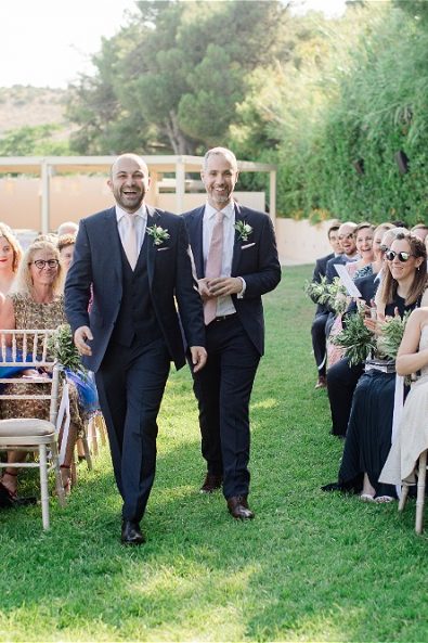 Groom walking down on aisle
