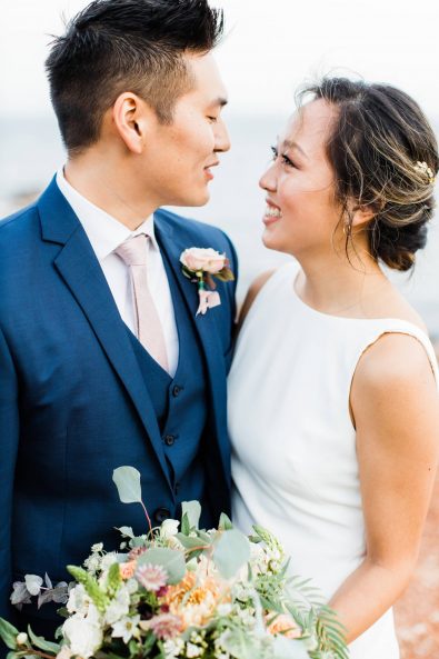 Bride and groom looking at each other's eyes for a late autumn destination wedding in the Athenian Riviera, Greece.