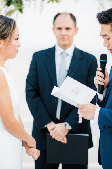 The Korean groom reading his vows to his bride.