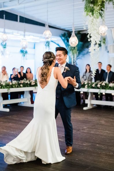 Korean bride and groom sharing their first dance at their wedding reception.