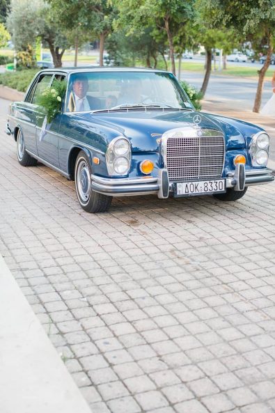 Vintage blue wedding Mercedes car.