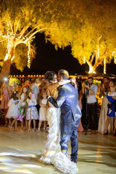 Bride and groom couple in love kissing while dancing their first dance.