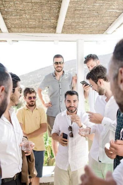 The friends of the groom drinking and having fun before the wedding.