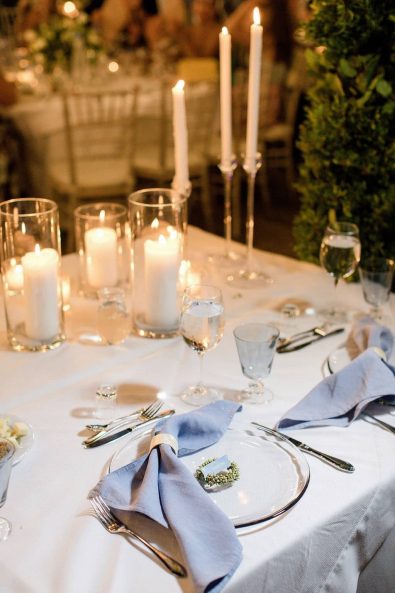 Light blue napkins and silver flatware table setting for a summer destination wedding in Sifnos.
