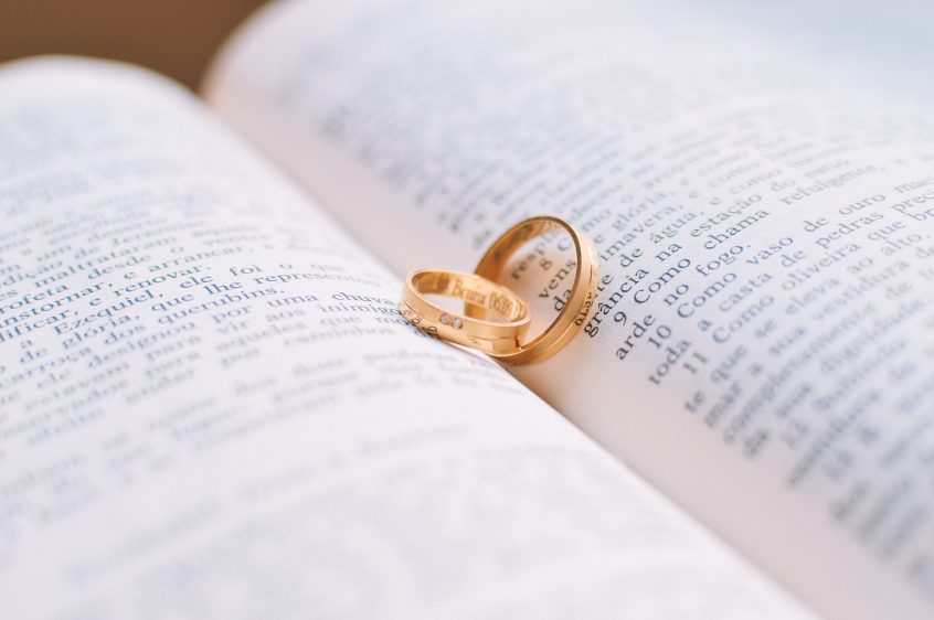 wedding rings on book