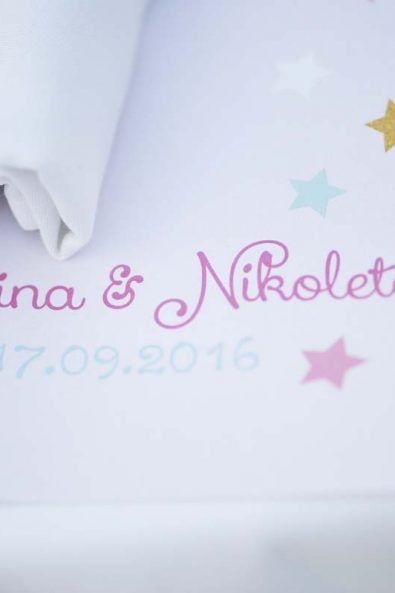 Table placemats for baptism dinner with names and little stars.