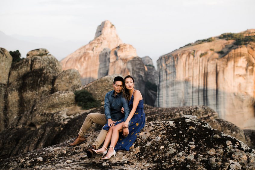 Couple at mountain side enjoying honeymoon after getting married in Greece