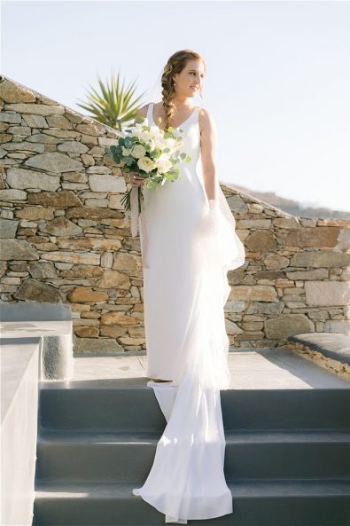 Bride in dress holding flowers