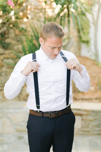 Groom getting dressed