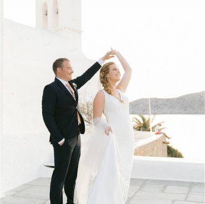 Bride and Groom in white church at destination wedding in Ios