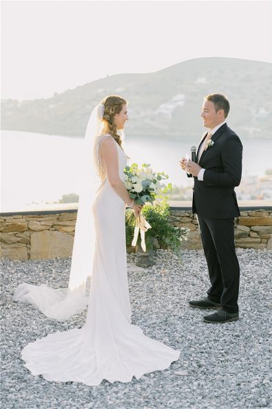 Bride and groom reading vows to each other