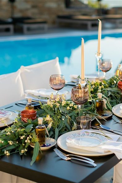 view of wedding table with flowers and candles at destination wedding in Ios
