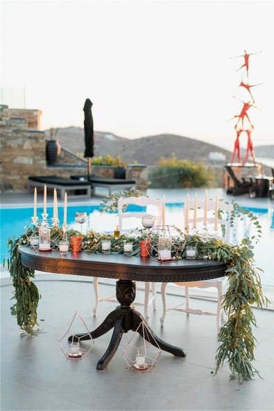Table with wedding decorations in front of pool