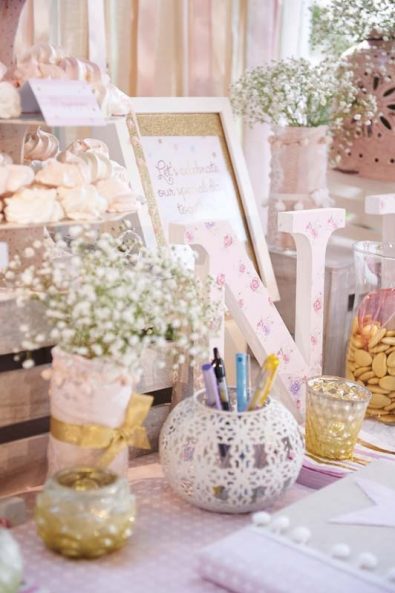 Shabby chic Greek orthodox baptism christening decoration for a baby girl with pink roses, polka dots, baby's breath flowers, and gold koufeta.