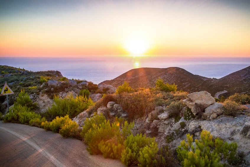 View of sea and mountains during sunset